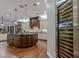 Gourmet kitchen features custom cabinets, granite counters, and a wine fridge at 52 Innisbrook Ave, Las Vegas, NV 89113
