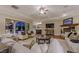 Inviting living room featuring fireplace, hardwood floors, comfortable seating, with outdoor pool access at 52 Innisbrook Ave, Las Vegas, NV 89113