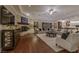 Spacious living room with hardwood floors, fireplace, comfortable seating, and an open layout at 52 Innisbrook Ave, Las Vegas, NV 89113