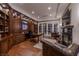 Executive home office with custom built-ins, wood floors, and abundant natural light at 52 Innisbrook Ave, Las Vegas, NV 89113