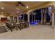 Inviting patio with a seating area, columns, arched ceiling, and a view of the pool at night at 52 Innisbrook Ave, Las Vegas, NV 89113