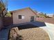 Private backyard with patio and low-maintenance gravel landscaping at 5474 Jacobs Field St, Las Vegas, NV 89148