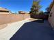 Enclosed backyard features a concrete patio and low-maintenance gravel area at 5474 Jacobs Field St, Las Vegas, NV 89148