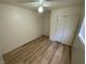 Bedroom features wood-look flooring and a ceiling fan at 5474 Jacobs Field St, Las Vegas, NV 89148
