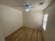 Clean bedroom with wood-look floors has natural light from a window with white blinds at 5474 Jacobs Field St, Las Vegas, NV 89148