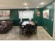 Dining area featuring a wood table with six chairs, with natural light from the window at 5804 Balzar Ave, Las Vegas, NV 89108