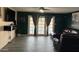 An open living area featuring a TV and glass doors offering a view of the pool at 5804 Balzar Ave, Las Vegas, NV 89108
