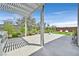 Beautiful backyard featuring a pergola, patio, lounge chairs, and meticulously designed landscaping at 6184 Willow Rock St, Las Vegas, NV 89135