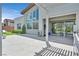 Spacious backyard featuring a covered patio, outdoor kitchen, and manicured landscaping at 6184 Willow Rock St, Las Vegas, NV 89135