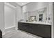 Bright bathroom showcasing dual sinks, modern fixtures, and neutral wall paint at 6184 Willow Rock St, Las Vegas, NV 89135
