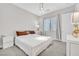 Comfortable bedroom with neutral colors, a ceiling light, and ample natural light at 6184 Willow Rock St, Las Vegas, NV 89135