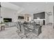 Open-concept kitchen and dining area with modern furnishings and ample space for entertaining at 6184 Willow Rock St, Las Vegas, NV 89135