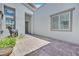 Paver walkway to the front door with horse statue and gray trim windows at 6184 Willow Rock St, Las Vegas, NV 89135