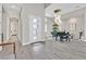 Grand foyer with high ceilings, piano, and wood look tile flooring at 6184 Willow Rock St, Las Vegas, NV 89135