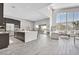 Open-concept living area with a large island, modern kitchen, and lots of light at 6184 Willow Rock St, Las Vegas, NV 89135