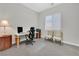 Comfortable office space with a desk, ergonomic chair, and natural light at 6184 Willow Rock St, Las Vegas, NV 89135