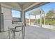 Outdoor kitchen area featuring a built-in grill and dining space under a pergola at 6184 Willow Rock St, Las Vegas, NV 89135