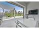 Covered outdoor patio includes a dining area and a view of the landscaped backyard at 6184 Willow Rock St, Las Vegas, NV 89135
