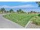 Well maintained grounds at Oak Leaf Park feature walking paths and grassy open space at 6184 Willow Rock St, Las Vegas, NV 89135