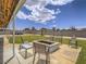 Serene backyard retreat featuring a cozy fire pit area, perfect for gatherings and enjoying outdoor moments at 6235 Westwind Rd, Las Vegas, NV 89118