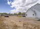 Large backyard with a patio, hot tub, and potential for landscaping or recreational activities at 6235 Westwind Rd, Las Vegas, NV 89118