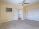 Bedroom features a ceiling fan, adjacent closet, and open door to a landing at 6235 Westwind Rd, Las Vegas, NV 89118