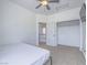 Neutral bedroom features a ceiling fan, closet and open door to landing at 6235 Westwind Rd, Las Vegas, NV 89118