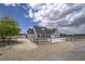 Scenic view of home with a well-maintained yard and charming curb appeal at 6235 Westwind Rd, Las Vegas, NV 89118