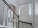 Elegant foyer featuring a staircase and a view of the front door with glass panels at 6235 Westwind Rd, Las Vegas, NV 89118