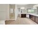 Primary bathroom with dual vanities, walk-in shower, and separate soaking tub at 7380 Abundant Harvest Ave, Las Vegas, NV 89131