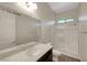 Bathroom featuring a vanity sink, mirror, toilet, and glass-enclosed shower at 7380 Abundant Harvest Ave, Las Vegas, NV 89131