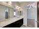 Bathroom featuring double sinks and a view into the bedroom at 7380 Abundant Harvest Ave, Las Vegas, NV 89131