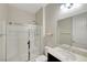 Bathroom features a glass enclosed shower and neutral vanity at 7380 Abundant Harvest Ave, Las Vegas, NV 89131