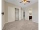 Neutral bedroom featuring a ceiling fan, closet, and attached bathroom at 7380 Abundant Harvest Ave, Las Vegas, NV 89131
