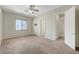 Bedroom featuring a window and a door leading to an adjoining room at 7380 Abundant Harvest Ave, Las Vegas, NV 89131