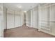 Large walk-in closet featuring extensive built-in shelving and hanging space for optimal organization at 7380 Abundant Harvest Ave, Las Vegas, NV 89131