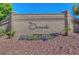 Stone sign at The Orchards community entrance with colorful flower beds and landscaping at 7380 Abundant Harvest Ave, Las Vegas, NV 89131