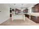 Spacious kitchen with a center island, stainless steel appliances, and ample cabinet space at 7380 Abundant Harvest Ave, Las Vegas, NV 89131