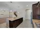 Open kitchen features a large island with granite countertop and stainless steel appliances at 7380 Abundant Harvest Ave, Las Vegas, NV 89131