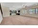 Living room view into kitchen, featuring stainless steel appliances at 7380 Abundant Harvest Ave, Las Vegas, NV 89131