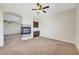 Open concept living room with a fireplace and neutral decor, ideal for gatherings at 7380 Abundant Harvest Ave, Las Vegas, NV 89131
