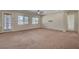 Open living room showcasing natural light, neutral tones, and seamless transitions to adjacent rooms at 7380 Abundant Harvest Ave, Las Vegas, NV 89131
