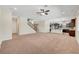 Bright living area seamlessly connects to the kitchen with an eat-in island, offering functional open-concept living at 7380 Abundant Harvest Ave, Las Vegas, NV 89131