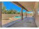 Covered patio area with a pool view, offering a relaxing outdoor living space at 7380 Abundant Harvest Ave, Las Vegas, NV 89131
