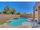 Sparkling pool and spa with lush landscaping and mature trees, offering a private retreat at 7380 Abundant Harvest Ave, Las Vegas, NV 89131