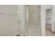Bathroom shower featuring glass doors and a tiled interior at 7380 Abundant Harvest Ave, Las Vegas, NV 89131