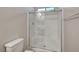 Bathroom shower featuring glass doors and tiled interior at 7380 Abundant Harvest Ave, Las Vegas, NV 89131