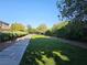 Walking path through a green space in a well-maintained community at 7380 Abundant Harvest Ave, Las Vegas, NV 89131