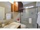 Bathroom featuring a vanity, shower, decorative mirror, and storage in a compact space at 7520 Fontera Ct, Las Vegas, NV 89139