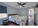 Bedroom with a window, wooden bedside table, and access to a walk-in closet, offering ample storage at 7520 Fontera Ct, Las Vegas, NV 89139